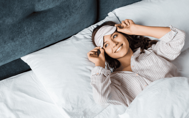 Woman waking up in bed using the 17 second manifestation technique