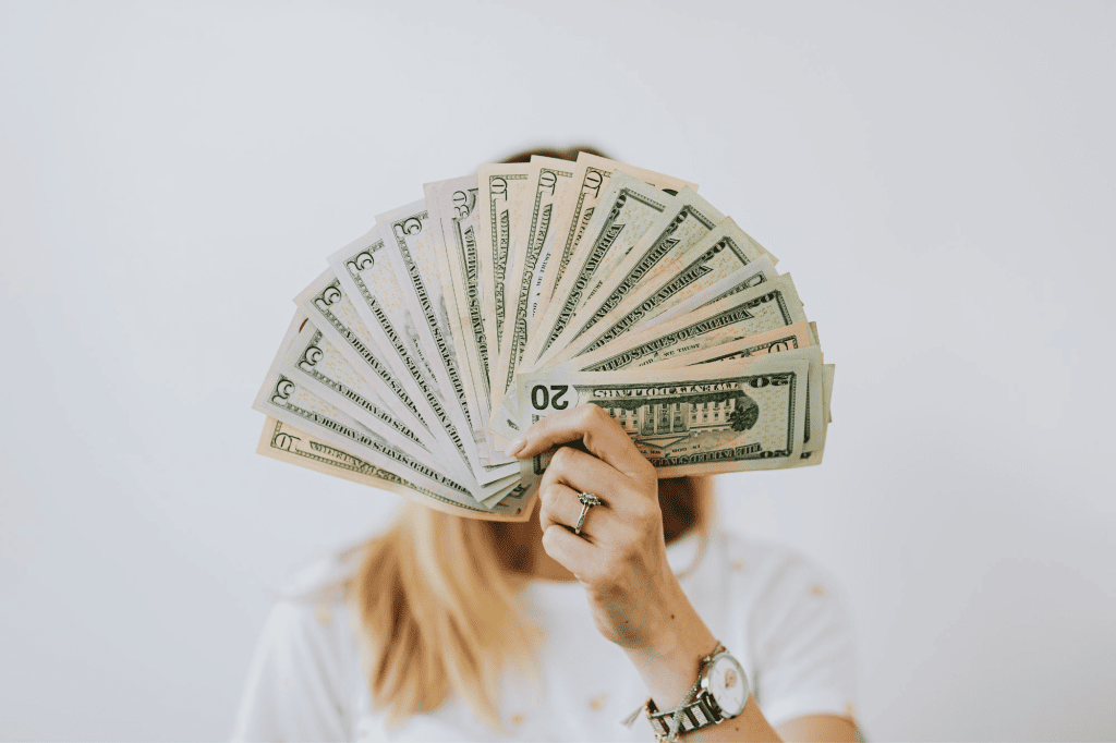 Woman holding money in hand