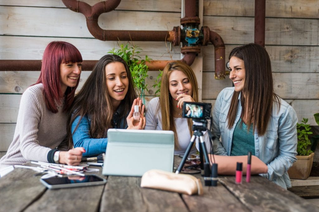Four women making a video together