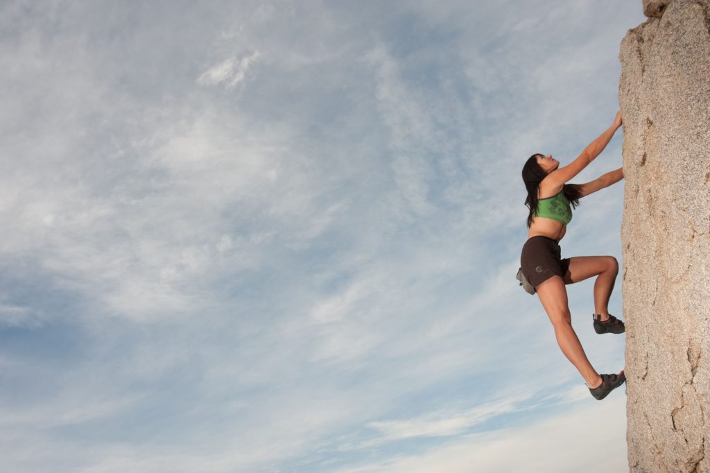 woman rock climbing