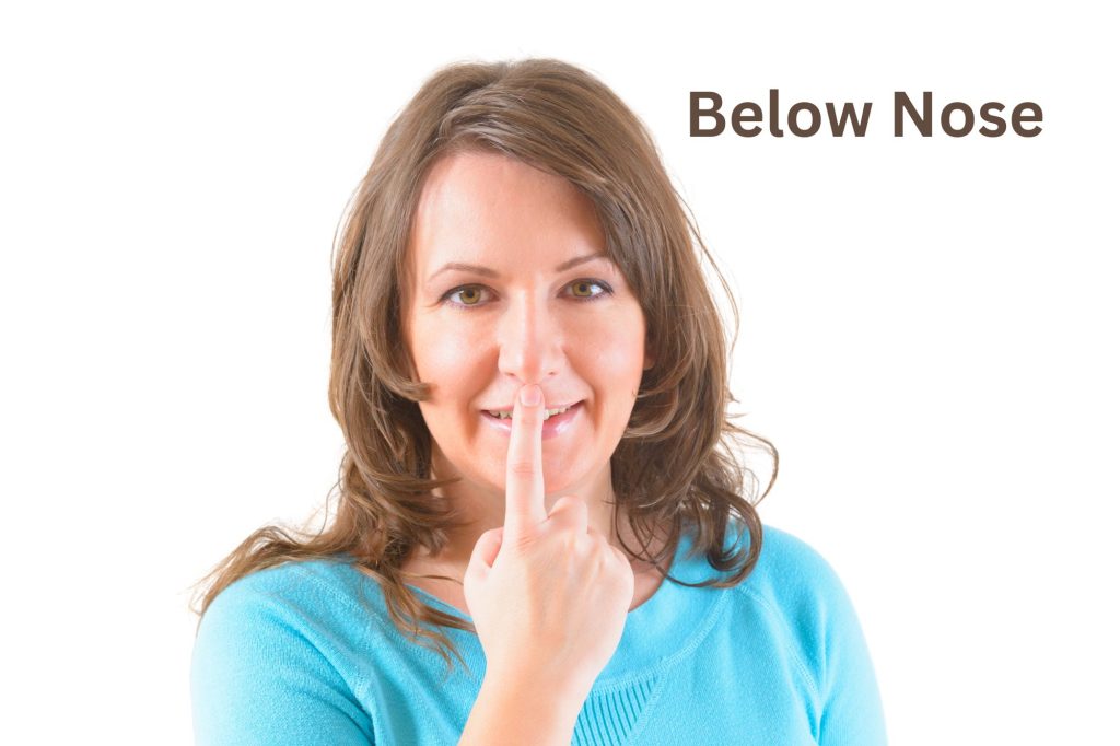 below nose tapping point